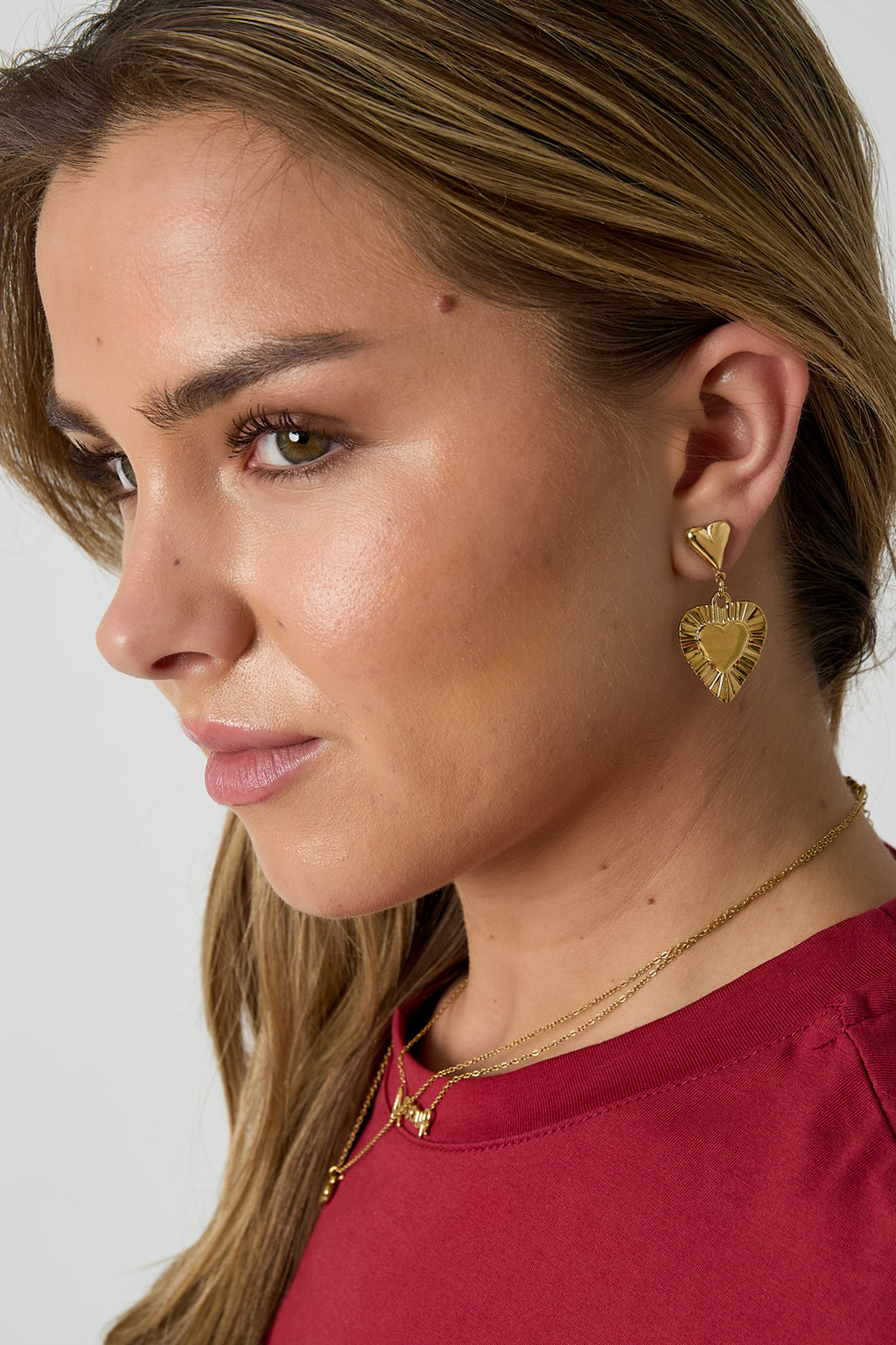 Earrings with heart-shaped pendants