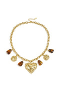 Link chain with dangling beaded coins and statement heart