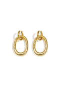 Statement earrings with detailed oval pendant