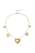 Necklace with beads and different shaped hearts