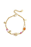 Double bracelet with varying pendants, beads, and stones